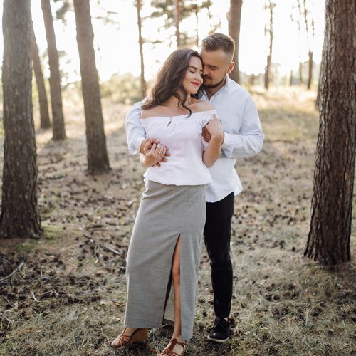 Young couple in love walking in the park